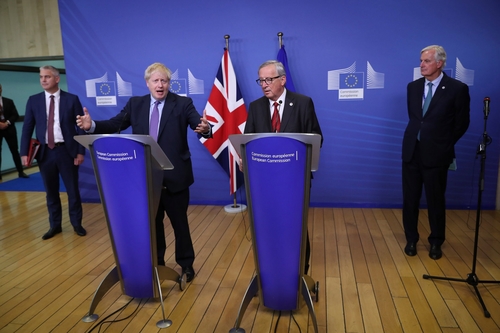British Prime Minister Boris Johnson and European Commission President Jean-Claude Juncker announcing agreement yesterday.