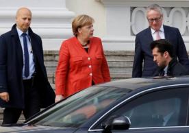 Angela Merkel getting into a car